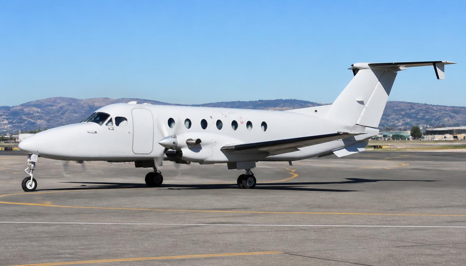 Beechcraft 1900 taxiing on an airport taxiway in daylight